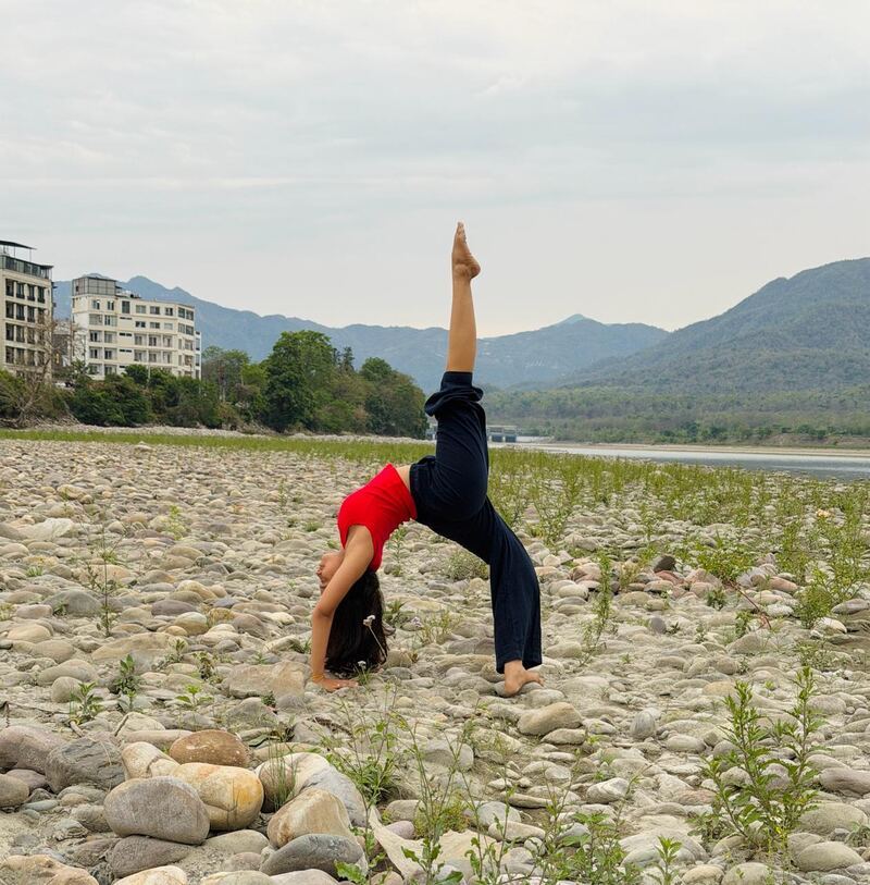 Wheel pose on the banks of the Ganga, Rishikesh